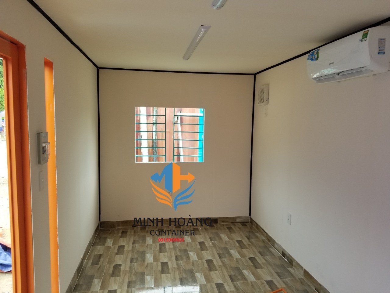 Container văn phòng 20 feet xanh viền cam có toilet
